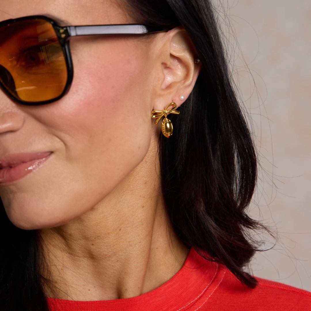 Gold Football & Bow Drop Studs - Image 2